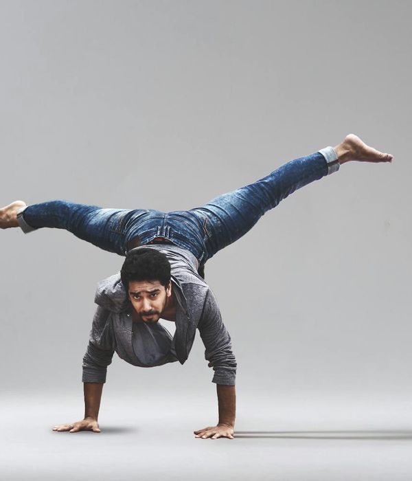 Man performing a controlled strength exercise with focus.